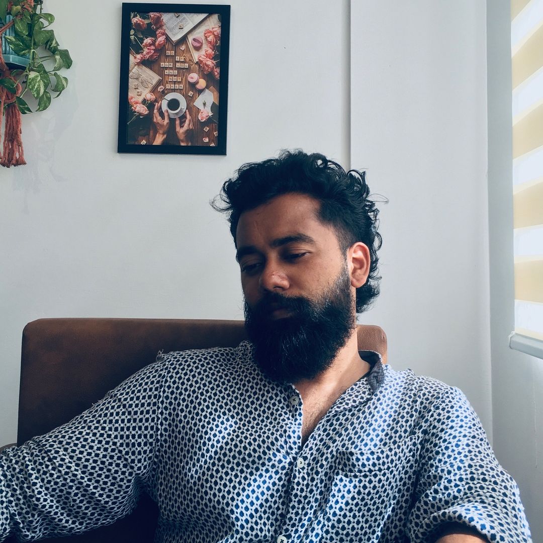 a man sitting in sofa