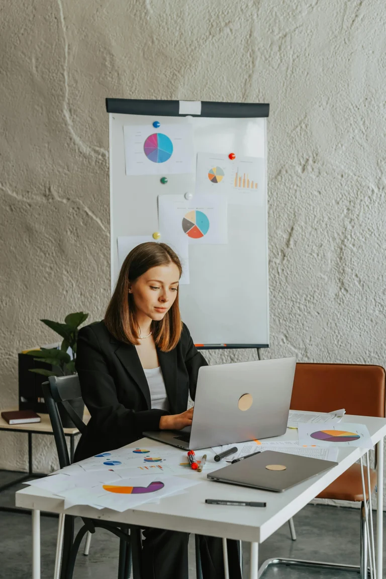 a woman looking in to the laptop